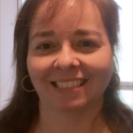 Photo of smiling Theresa Revans-McMenimon